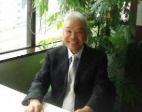 株式会社アドコム　代表取締役　佐野 敏夫